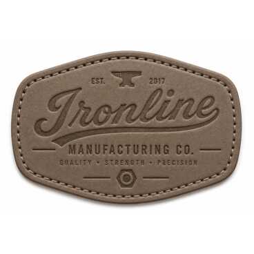 Leather patch with embossed text and an anvil symbol.