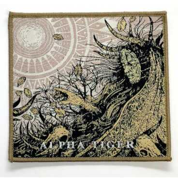 Woven patch depicting a mythical figure and celestial designs with the words 'ALPHA TIGER'.